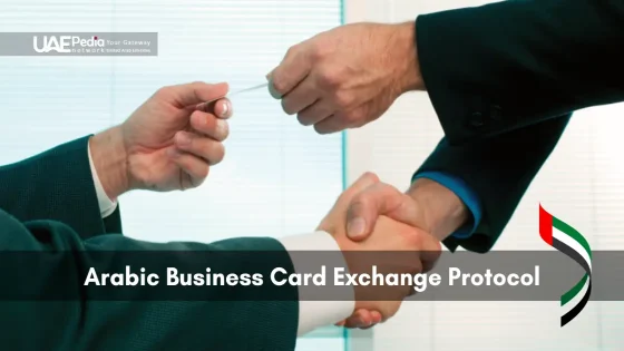 Business card exchange between two professionals with UAE-themed background
