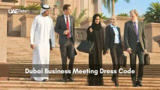 Group of professionals in traditional and modern dress after a Dubai meeting.