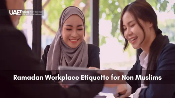 Muslim and non-Muslim colleagues smiling during a professional meeting.
