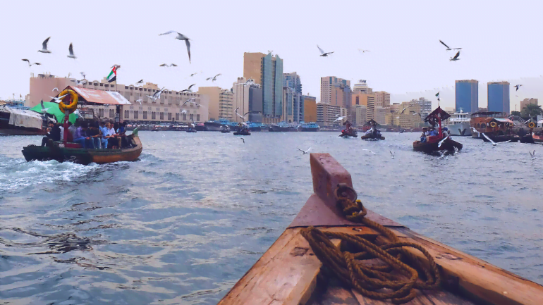 Riding an abra and explore Dubai Creek History in the sea