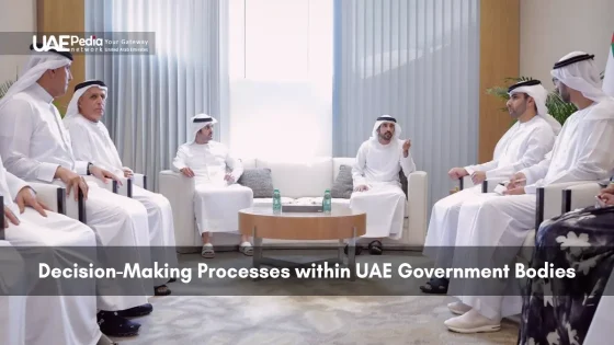 Group of UAE dignitaries and ministers seated around a low table in kanduras for a high-level meeting