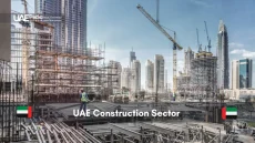 Bustling construction site in the UAE with cranes and workers