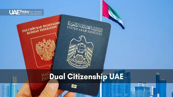 Hand holding both Russian Federation and United Arab Emirates passports with skyline.