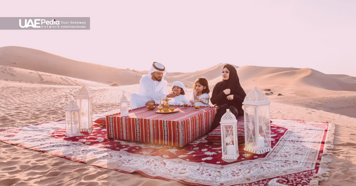 A family enjoying a meal in the desert, showcasing UAE's cultural heritage and family bonds.