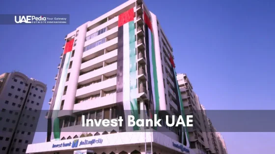 Invest Bank UAE building with prominent UAE flag decorations on the facade.