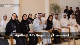 Group of Emirati professionals at a forum discussing UAE regulations beneath UAEPedia logo