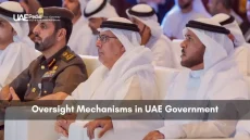 Group of UAE government figures and a military officer seated at a session on oversight mechanisms.