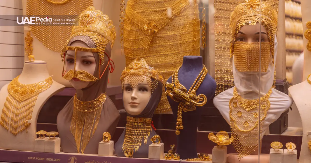 Dubai shop showcasing ornate gold jewelry on mannequin heads.