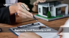 Signing land ownership agreement with model house