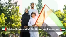 Emirati family with UAE flag outdoors