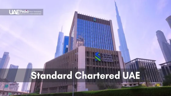 Standard Chartered UAE headquarters building with Burj Khalifa nearby.