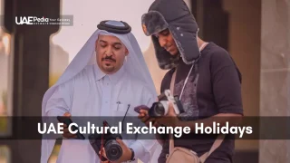 An Emirati man guiding a visitor in the UAE during a cultural exchange holiday.
