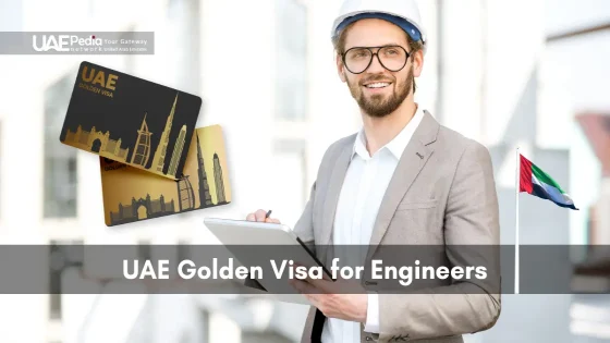 Male engineer wearing a hard hat holds a tablet next to two black-and-gold UAE Golden Visa cards.