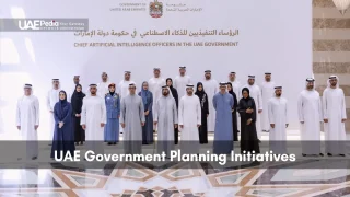 UAE government AI leaders assembled in traditional dress for an official photo.