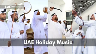 UAE musicians using drums and sticks to perform festive holiday music in traditional attire.