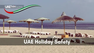 A quiet UAE beach with lounge chairs and palm trees, perfect for a safe holiday experience.