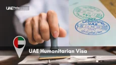 Hand using a visa stamp on paperwork alongside a zoomed-in view of UAE entry stamps in a passport