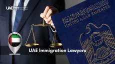 Lawyer’s hand balancing gold justice scales next to a United Arab Emirates passport.