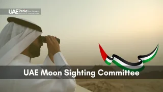 A member of the UAE Moon Sighting Committee uses binoculars to look at the moon in the UAE.