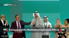 UAE officials celebrating with international delegates at a diplomatic event