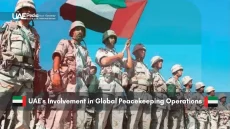 UAE peacekeeping troops standing in formation holding the national flag