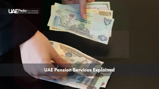 Hand holding UAE dirham currency notes for pension services