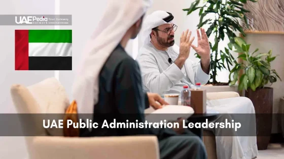 Two men in traditional Emirati dress seated, discussing leadership topics.