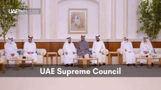The UAE Supreme Council members in a formal setting, engaged in national governance discussions.