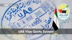 Detailed view of a blue UAE passport stamp overlaid with the country’s flag and seal.