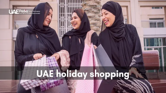 Smiling women in abayas holding shopping bags in UAE street scene.