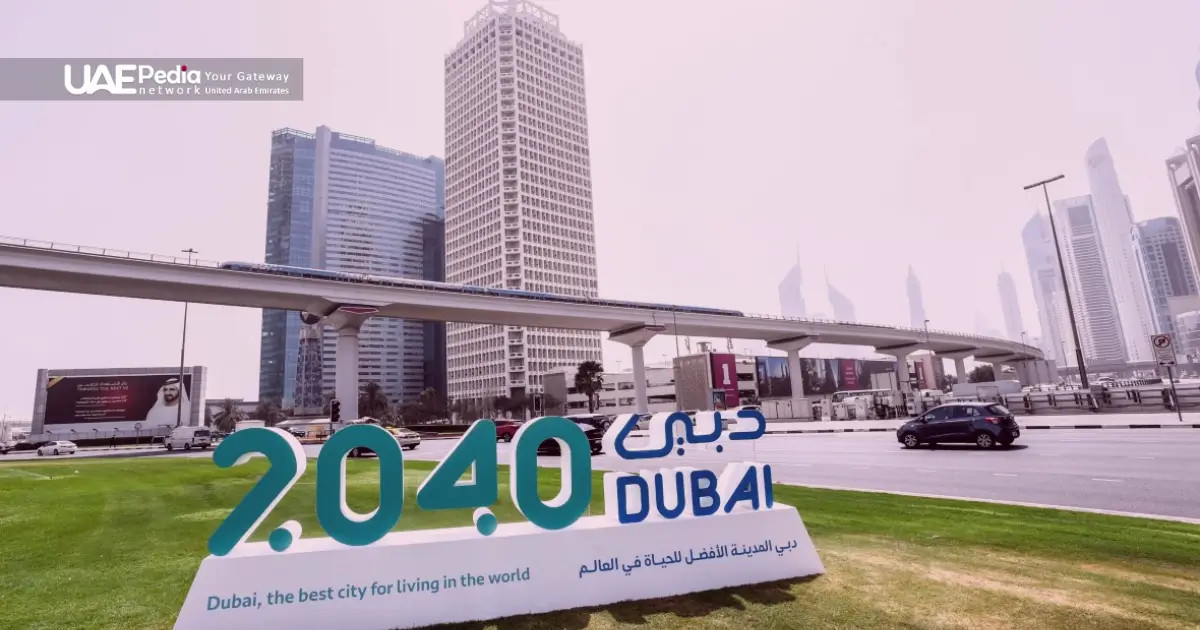 Dubai 2040 Plan sign with modern buildings and metro infrastructure.