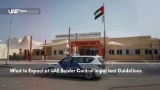 UAE police vehicle outside a building with UAE flag