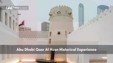 Historic Qasr Al Hosn fort in Abu Dhabi with modern buildings behind