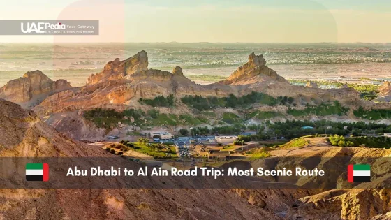 Scenic mountain route from Abu Dhabi to Al Ain with sunlit peaks.
