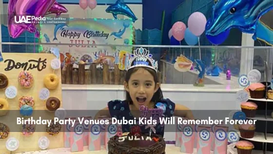 Smiling girl at a donut-themed birthday party with colorful decorations