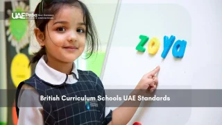Young girl pointing to magnetic letters spelling her name on a whiteboard