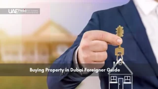 Man holding key with house symbol representing property ownership
