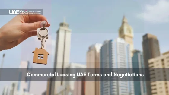 Hand holding a key with a city skyline background