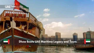Traditional UAE dhow boats docked with cityscape in background