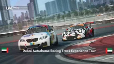 Sports cars racing on a track with Dubai skyline in the background