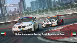 Sports cars racing on a track with Dubai skyline in the background