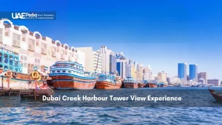 Traditional boats at Dubai Creek with modern buildings in view