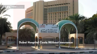 Front view of Dubai Hospital with arched entrance and signage