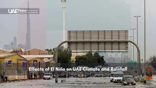 Flooded Dubai road with Burj Khalifa in background