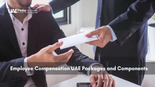 Employer handing envelope to seated employee in UAE office