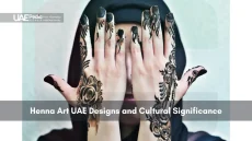 Woman showing intricate henna designs on both hands
