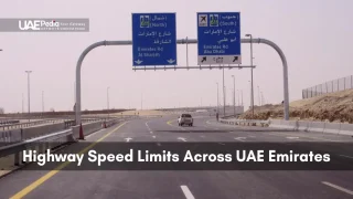 Image showing a highway sign for speed limits and directions across UAE emirates.