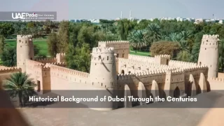 Restored historic fort structure surrounded by palm trees in Dubai