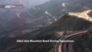 Twisting mountain road lit up at night on Jebel Jais in the UAE