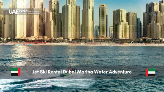 Person jet skiing in front of Dubai Marina skyscrapers